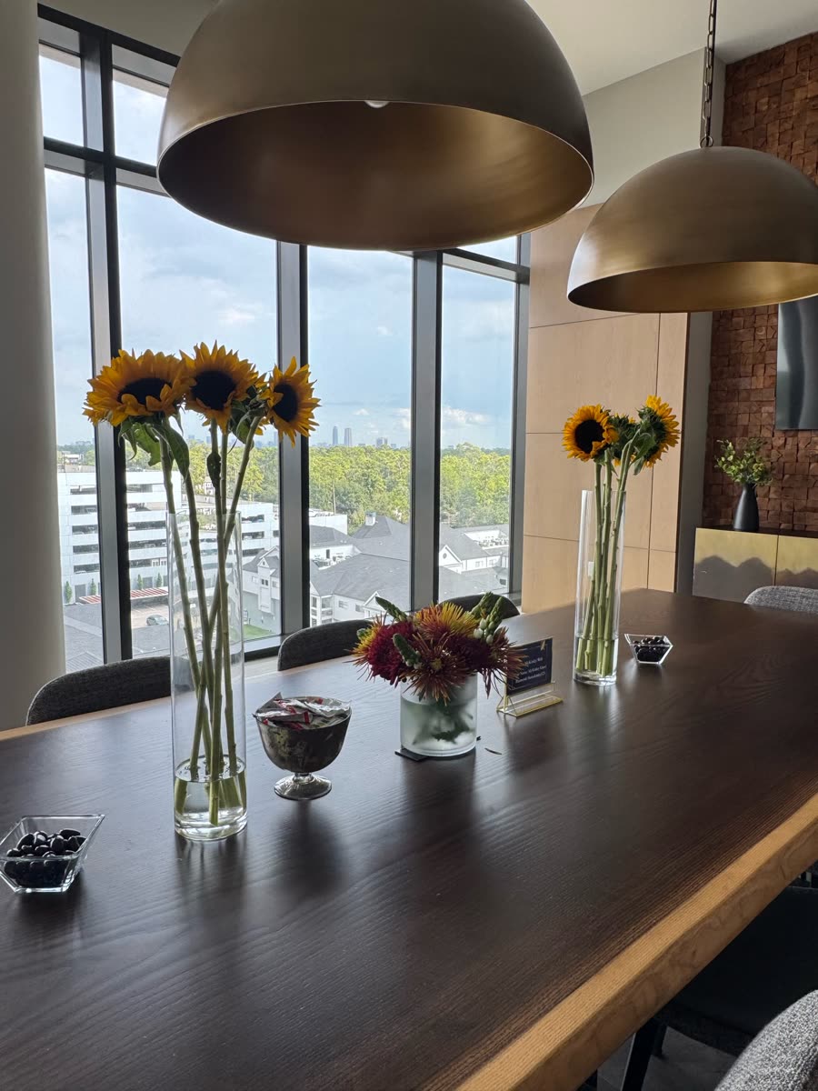 Conference table set with sunflowers before the Houston kickoff